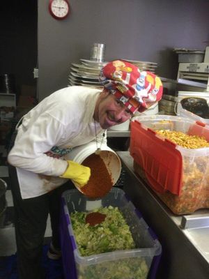 This last full moon ferment was Kimchi Madness! Here we are mixing the magic
kimchi sauce into the cabbage & radish before crocking at our fermatorium in
City Pizza.