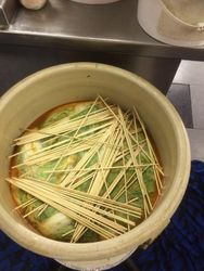 Bambo sticks help hold all down. Much CO2 gas is released during fermentation.